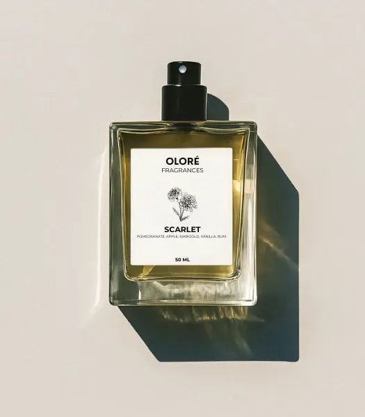 Olore Fragrances Scarlet perfume bottle with floral elements on a light gray background