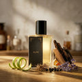Perfume bottle labeled 'Elite' on a wooden surface with decorative elements.